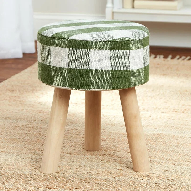 Runder Hocker mit Karostoffbezug