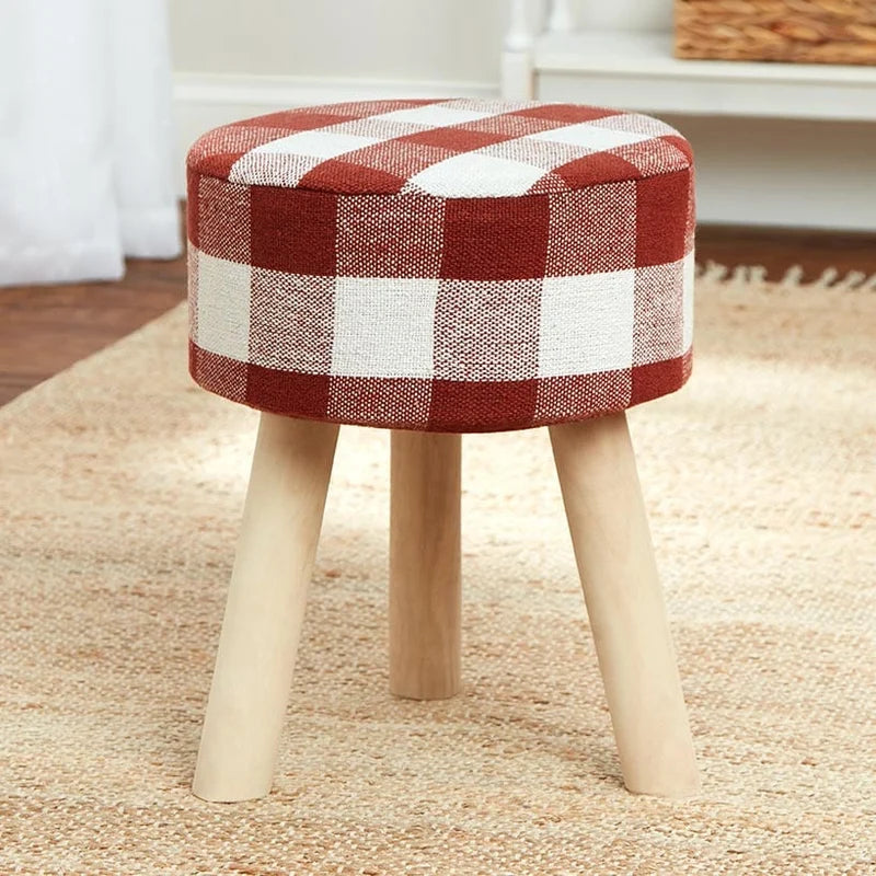 Runder Hocker mit Karostoffbezug
